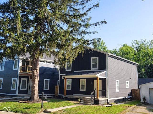 view of front of house featuring a front yard and a porch