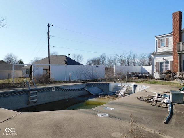 view of swimming pool with a patio area, a fenced in pool, and a fenced backyard