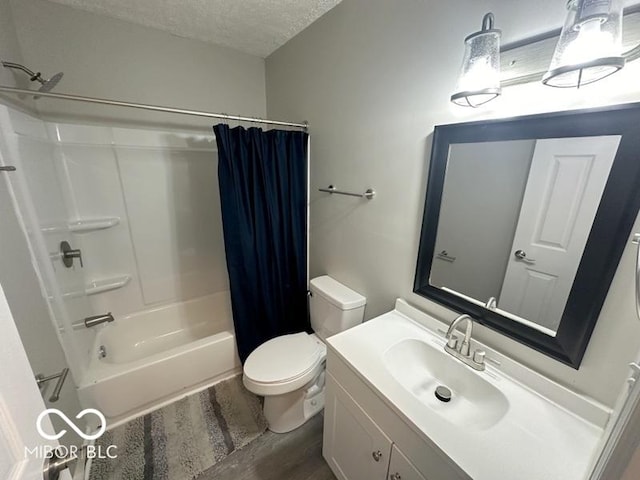 full bathroom featuring shower / tub combo, vanity, a textured ceiling, wood-type flooring, and toilet