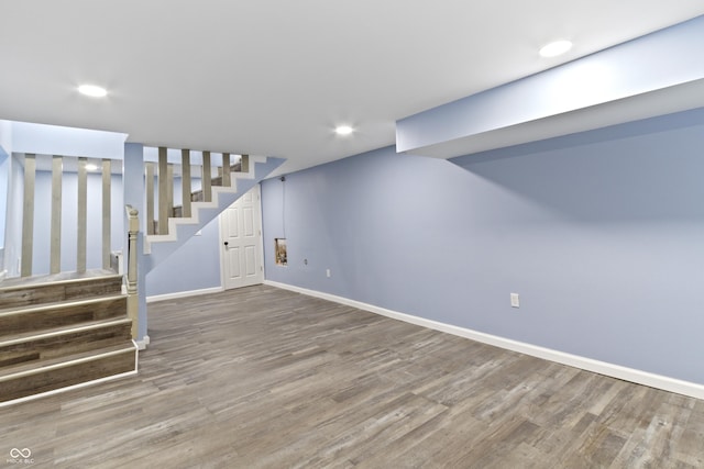 basement with hardwood / wood-style floors