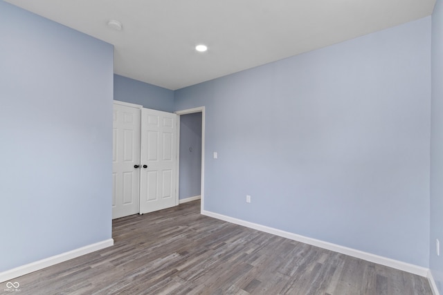 spare room featuring hardwood / wood-style flooring