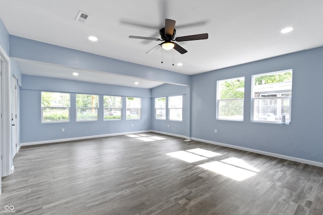 empty room with ceiling fan and hardwood / wood-style floors