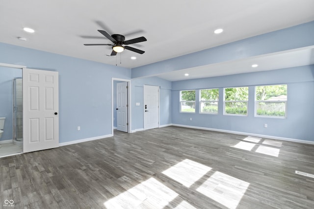 interior space featuring ceiling fan and dark wood-type flooring