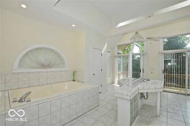 bathroom featuring tile patterned flooring and tiled tub