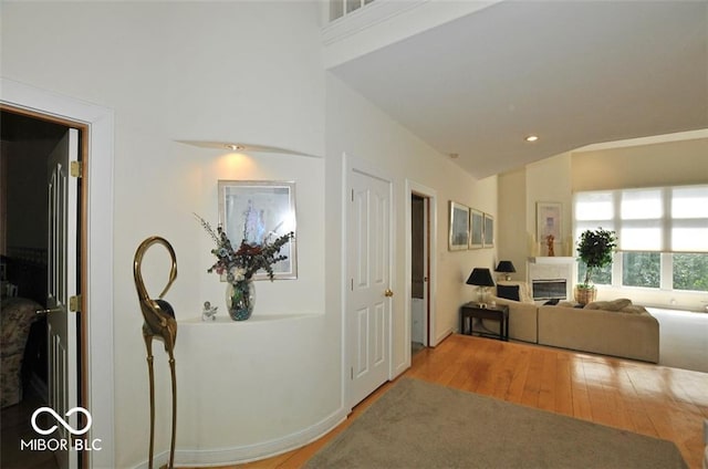 corridor featuring hardwood / wood-style floors