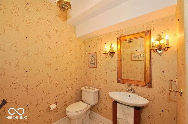 bathroom with tile patterned floors, sink, and toilet