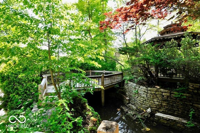 view of home's exterior featuring a wooden deck