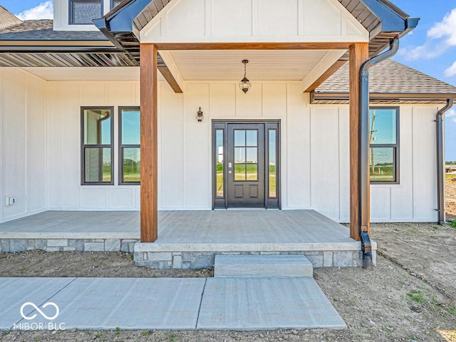 doorway to property featuring covered porch