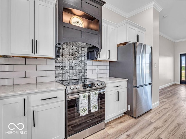 kitchen featuring crown molding, light stone counters, white cabinetry, and stainless steel appliances