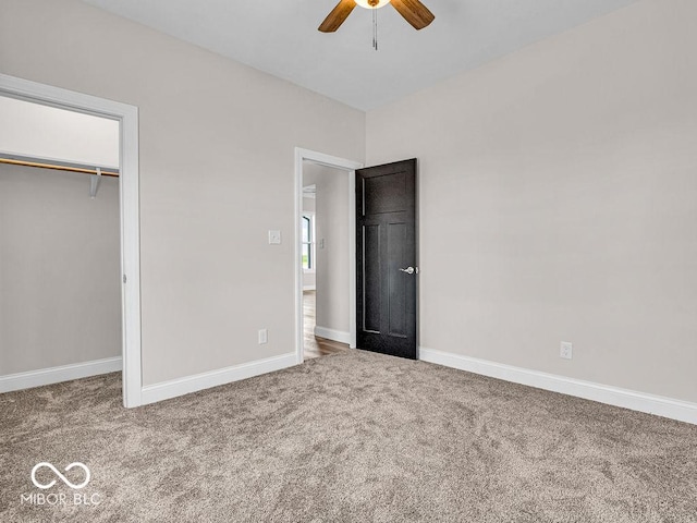 unfurnished bedroom with carpet, a closet, and ceiling fan