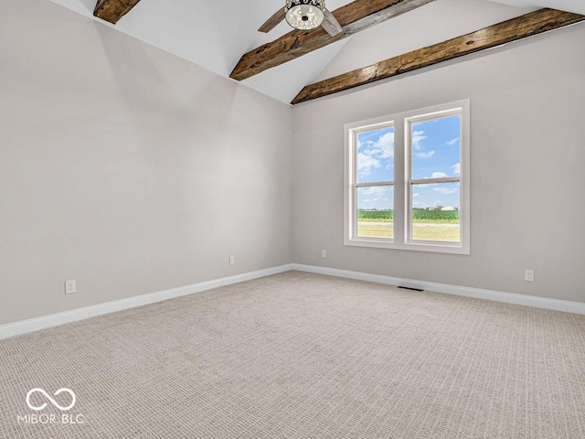 carpeted spare room featuring lofted ceiling with beams and ceiling fan