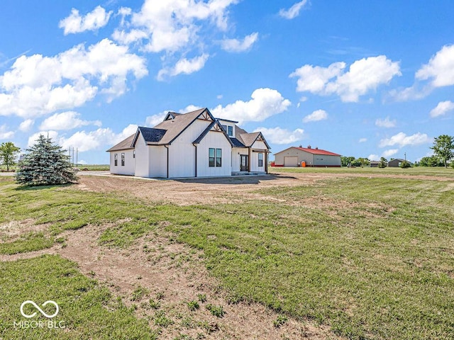 back of house with a yard