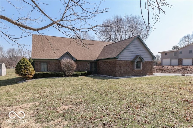 single story home with a front yard and a garage