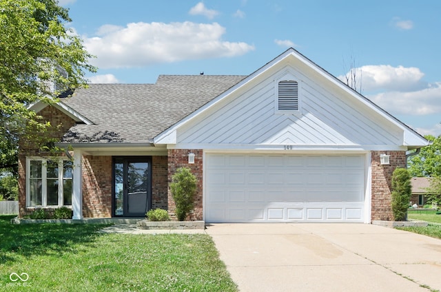 ranch-style home featuring a garage and a front lawn