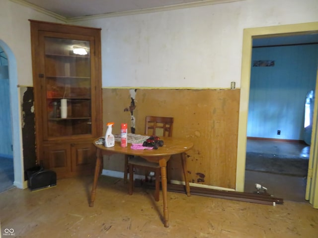 dining area featuring crown molding