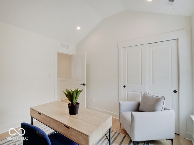 living area with recessed lighting, visible vents, baseboards, vaulted ceiling, and light wood finished floors