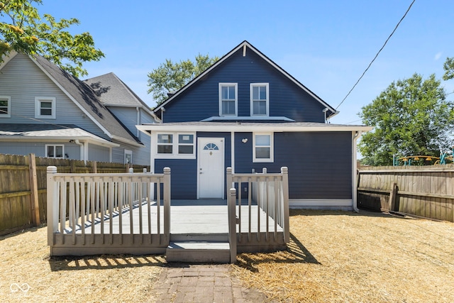 view of front facade featuring a fenced backyard and a wooden deck