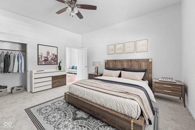 bedroom featuring a closet, ceiling fan, and light carpet