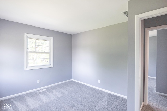 empty room with carpet flooring