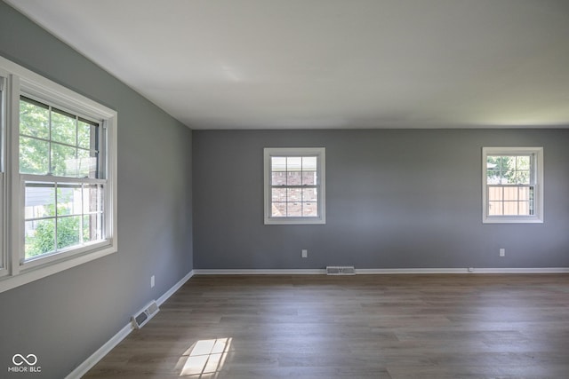 unfurnished room featuring wood-type flooring