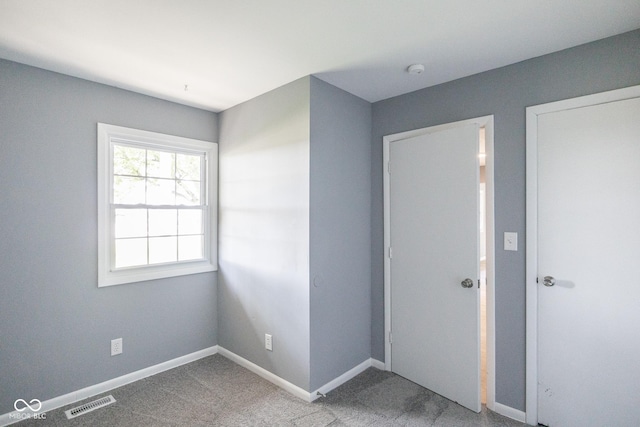 unfurnished bedroom featuring carpet floors