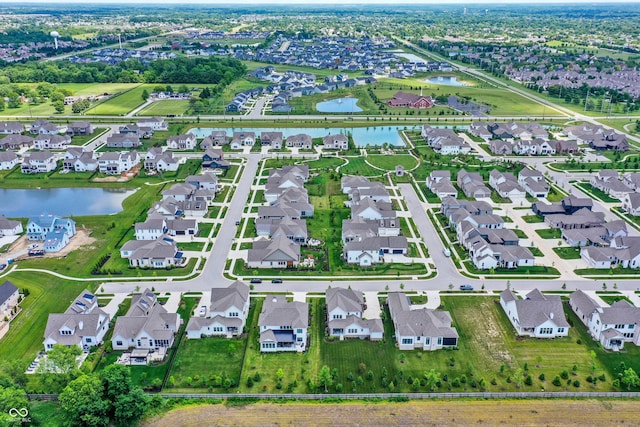 birds eye view of property with a residential view and a water view