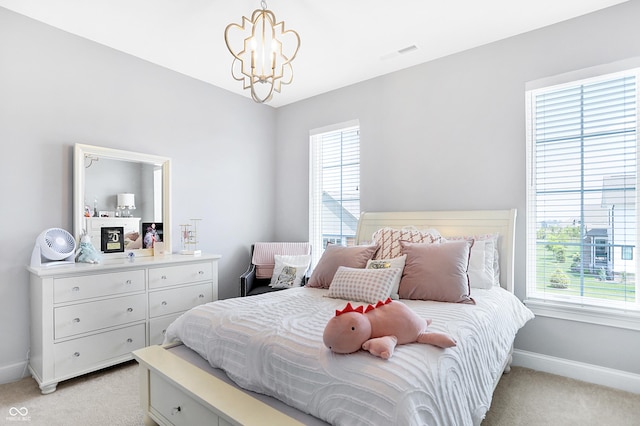 bedroom featuring light carpet, an inviting chandelier, visible vents, and baseboards