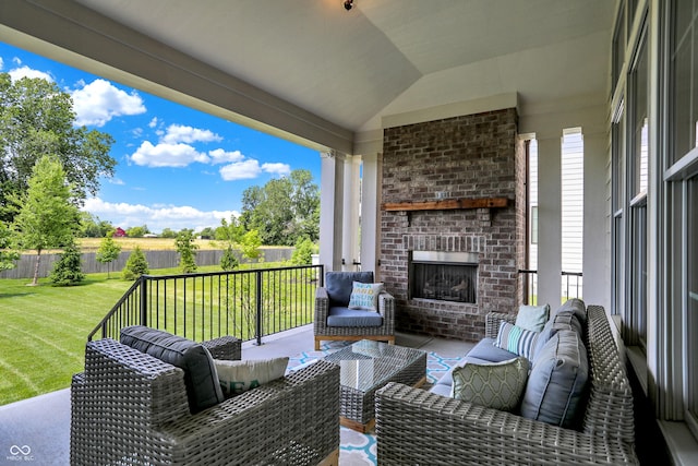 exterior space with an outdoor living space with a fireplace