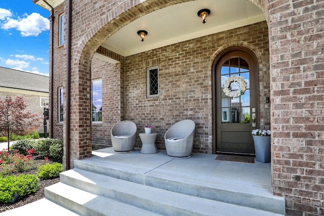 entrance to property with brick siding