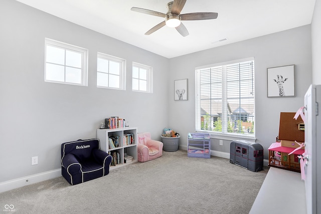 game room with carpet floors, visible vents, baseboards, and a ceiling fan