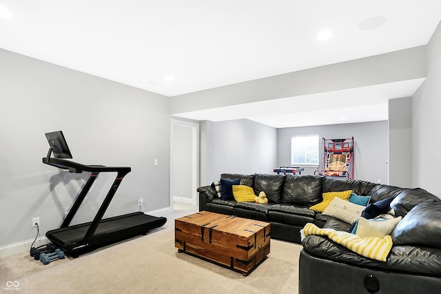 carpeted living room with recessed lighting and baseboards