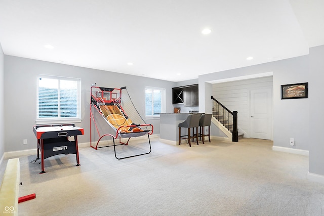 game room with baseboards, light colored carpet, a wealth of natural light, and recessed lighting