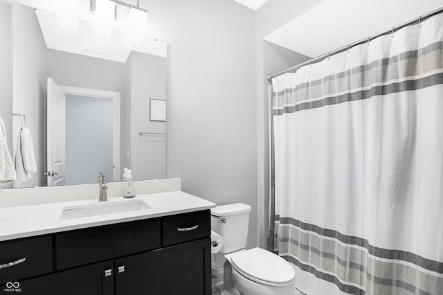 bathroom with toilet and vanity