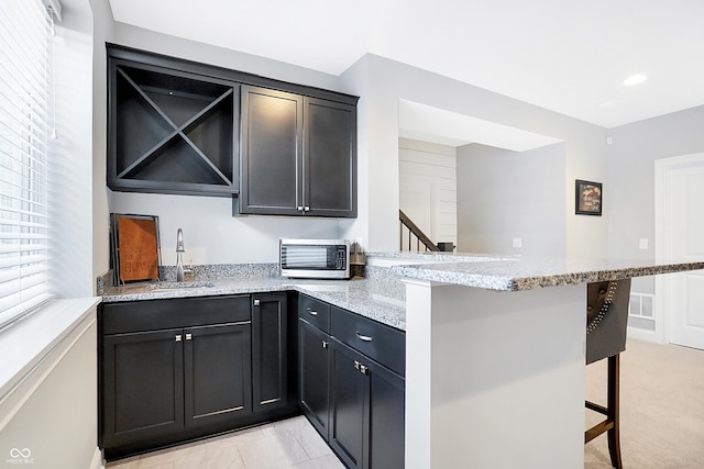 bar featuring a toaster, visible vents, a sink, indoor wet bar, and recessed lighting