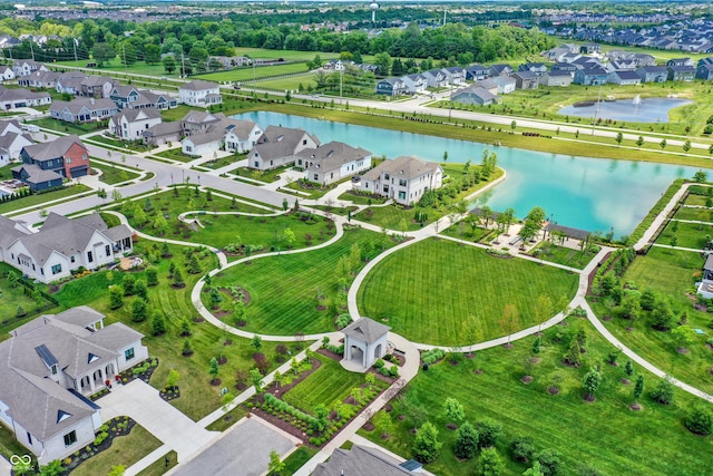 drone / aerial view featuring a residential view and a water view