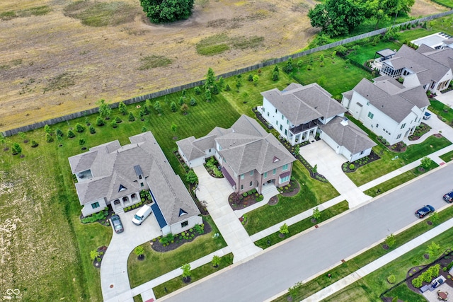 birds eye view of property with a residential view