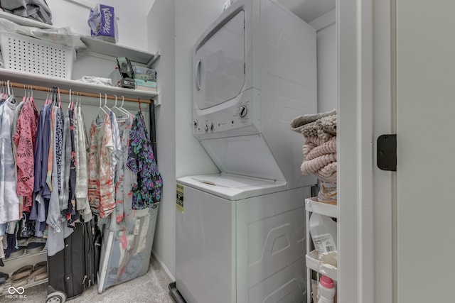 laundry area with laundry area and stacked washer / dryer