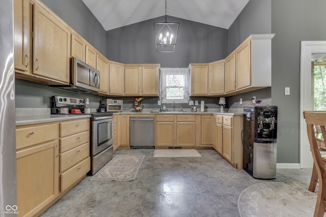 kitchen with stainless steel appliances, light brown cabinets, a sink, and an inviting chandelier