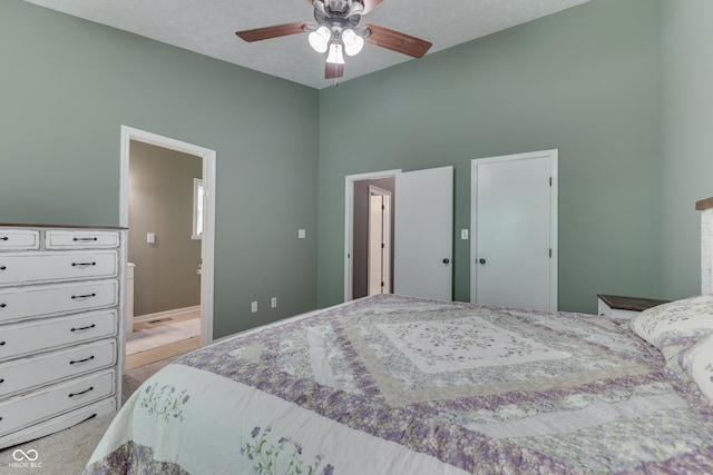 bedroom featuring light carpet, visible vents, and a ceiling fan