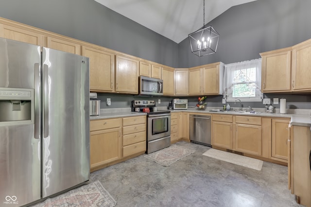 kitchen featuring stainless steel appliances, light countertops, light brown cabinets, and a sink