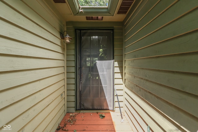 view of exterior entry featuring visible vents