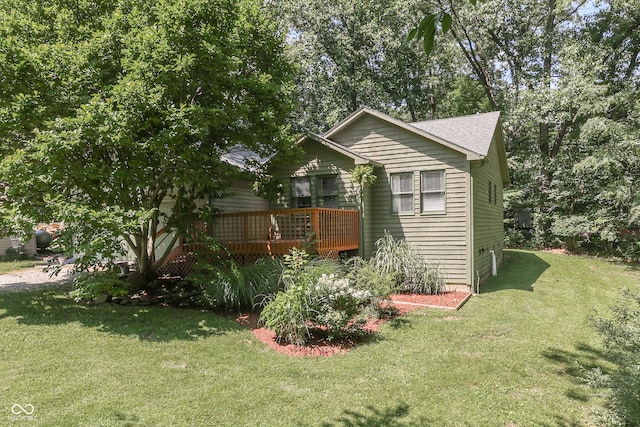 view of property exterior featuring a deck and a lawn