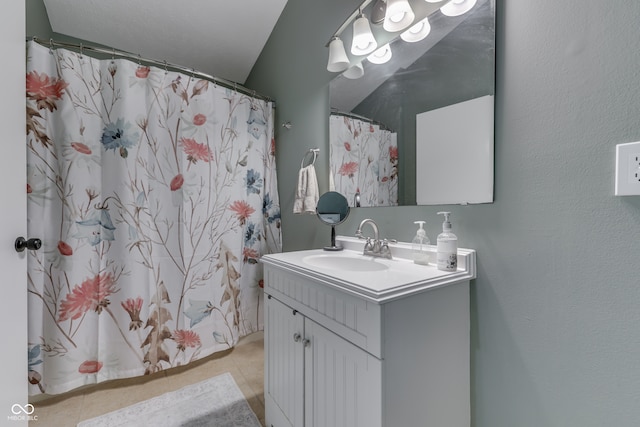 bathroom with vanity and tile patterned floors