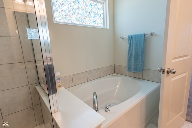 bathroom with a bath to relax in