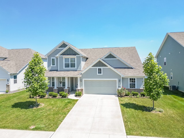 craftsman-style home with central AC and a front lawn