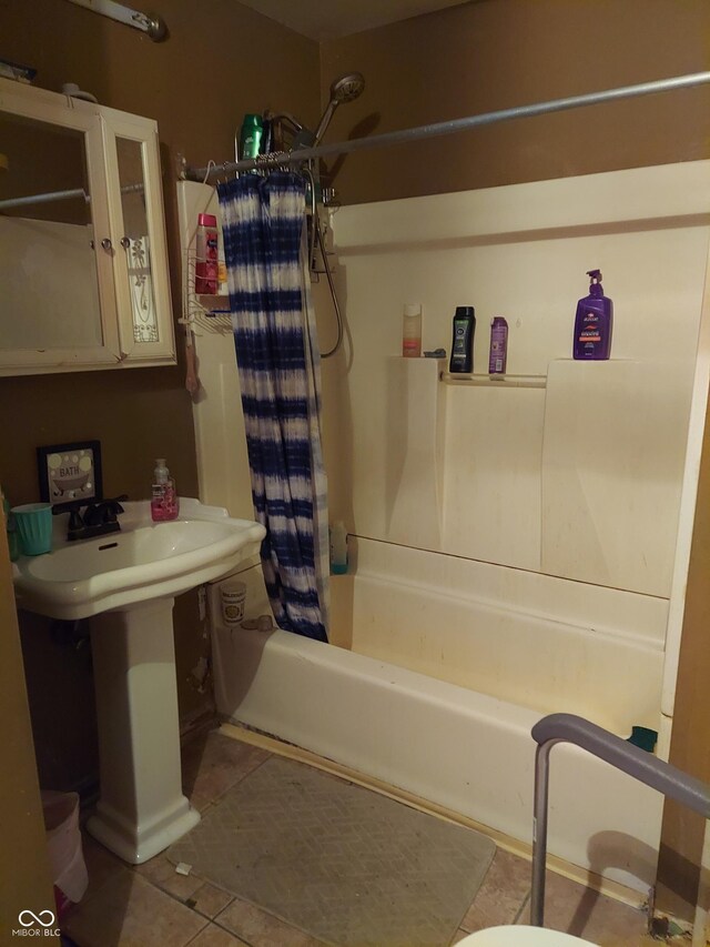 bathroom featuring tile patterned flooring and shower / bath combination with curtain