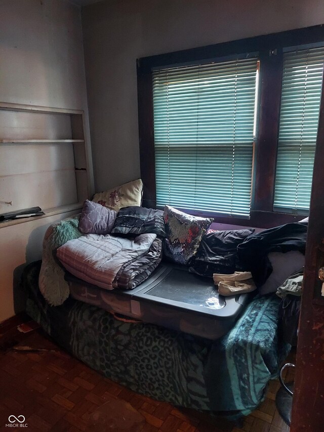 bedroom featuring parquet floors