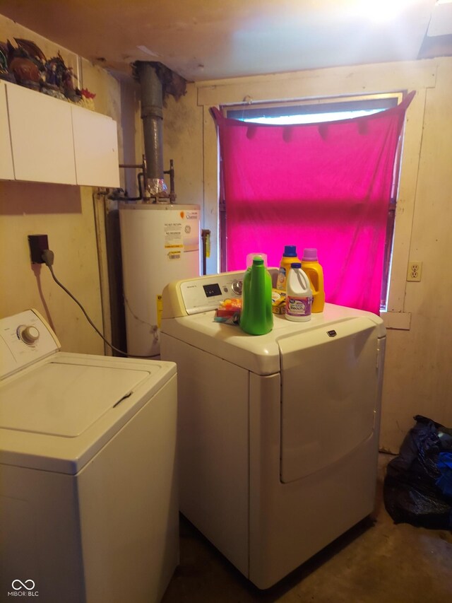 washroom featuring water heater and washer and dryer