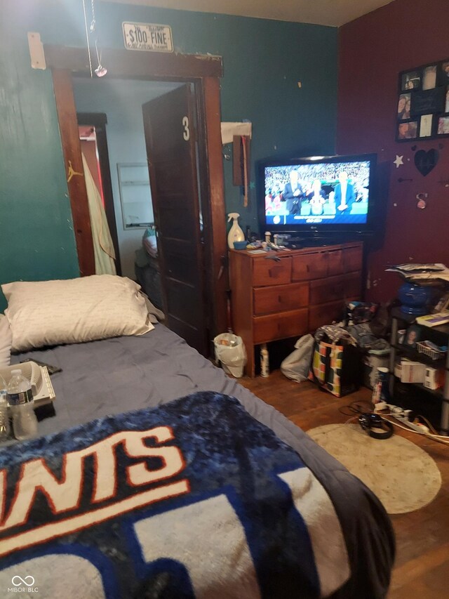 bedroom with wood-type flooring