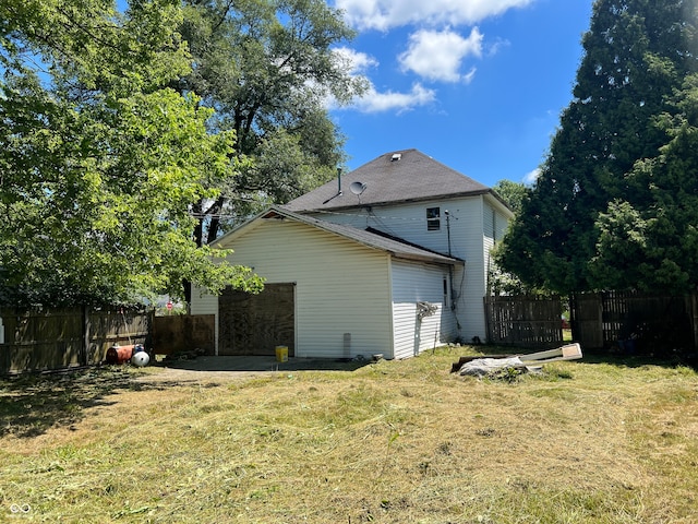 view of side of home featuring a lawn